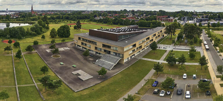 Aerial view of the Danish Gymnasium formerly the Bundeswehr Engineering Corps base featuring modern architecture and green spaces in Schleswig Schleswig Holstein Germany. Aerial view of the Danish Gymnasium formerly the Bundeswehr Engineering Corps base featuring modern architecture and green spaces in Schleswig Schleswig Holstein Germany.