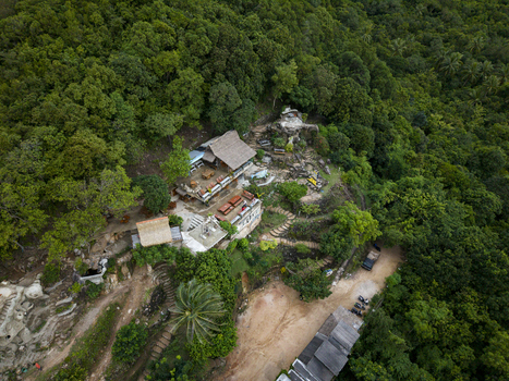 Aerial view of Bukit Love where structures nestle amidst the verdant embrace of dense forest Karimunjawa Jawa Tengah Indonesia. Aerial view of Bukit Love where structures nestle amidst the verdant embrace of dense forest Karimunjawa Jawa Tengah Indonesia.