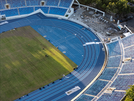 Aerial view of the blue running track and green field of the Olympic Stadium in Santo Domingo Santo Domingo Distrito Nacional Dominican Republic.