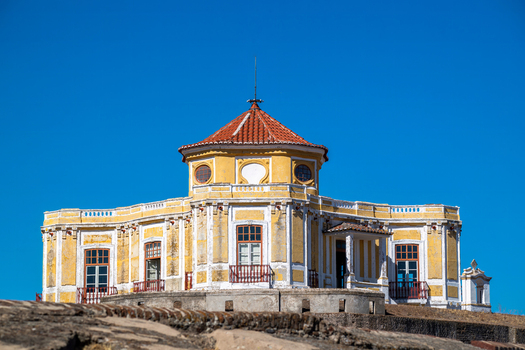 Elvas Portugal 10 September 2026 View of Forte de Nossa Senhora da Graca a historic yellow fortress with a red tiled roof under a clear blue sky. Elvas Portugal 10 September 2026 View of Forte de Nossa Senhora da Graca a historic yellow fortress with a red tiled roof under a clear blue sky.
