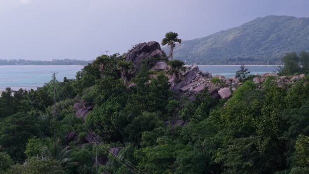 Aerial view of Praslin rocky hill and tropical forest Seychelles.
