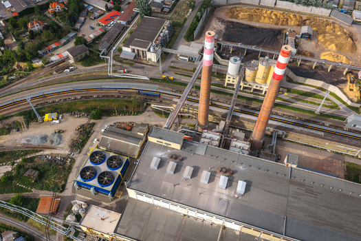 Aerial view of the Tepelna elektrarna Hodonin power station featuring tall striped chimneys and industrial infrastructure Hodonin Jihomoravsky kraj Czechia. Aerial view of the Tepelna elektrarna Hodonin power station featuring tall striped chimneys and industrial infrastructure Hodonin Jihomoravsky kraj Czechia.