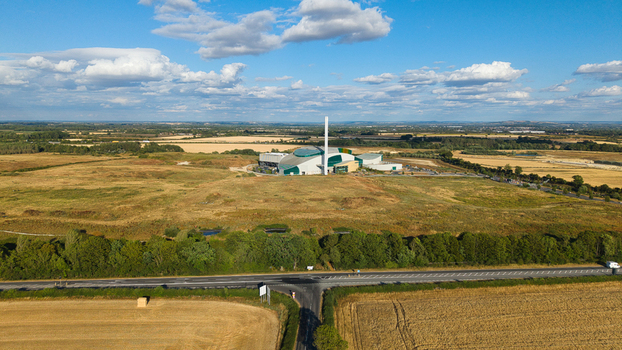 Aerial view of the Energy Recovery Facility a biomass to electricity plant surrounded by vast agricultural fields and rural landscape in Bicester England United Kingdom.