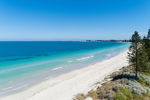 Aerial view of a pristine beach with turquoise water white sand and coastal vegetation in Perth Western Australia Australia. Aerial view of a pristine beach with turquoise water white sand and coastal vegetation in Perth Western Australia Australia.