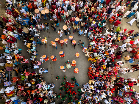 Dhaka Bangladesh 13 April 2026 Aerial view of a vibrant human tapestry a dense crowd forming a kaleidoscopic spectacle of contrasting colors.