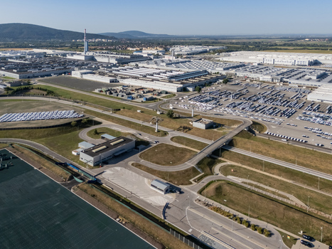 Aerial view of the Volkswagen Slovakia factory in Devinska Nova Ves with industrial buildings and vast parking lots filled with cars in Bratislava Bratislavsky kraj Slovakia. Aerial view of the Volkswagen Slovakia factory in Devinska Nova Ves with industrial buildings and vast parking lots filled with cars in Bratislava Bratislavsky kraj Slovakia.