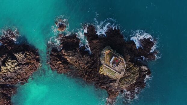 Aerial view of Phare de L Ost Pic lighthouse France.