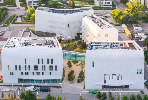 Aerial view of modern medical resort with white geometric buildings glass walkways and landscaped courtyards in Sopot Pomeranian Voivodeship Poland. Aerial view of modern medical resort with white geometric buildings glass walkways and landscaped courtyards in Sopot Pomeranian Voivodeship Poland.
