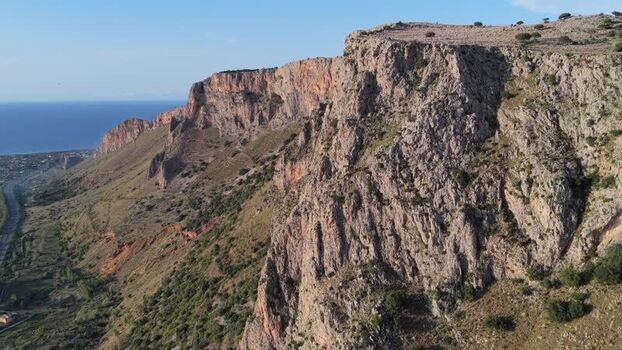 Aerial view of rocky cliffs along the coastline Italy.