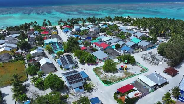 Aerial view of a tropical village with colorful rooftops Maldives. Aerial view of a tropical village with colorful rooftops Maldives.