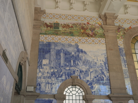 View of the intricate blue and white azulejo tile murals depicting historical scenes inside the Sao Bento Railway Station in Porto Porto District Portugal. View of the intricate blue and white azulejo tile murals depicting historical scenes inside the Sao Bento Railway Station in Porto Porto District Portugal.