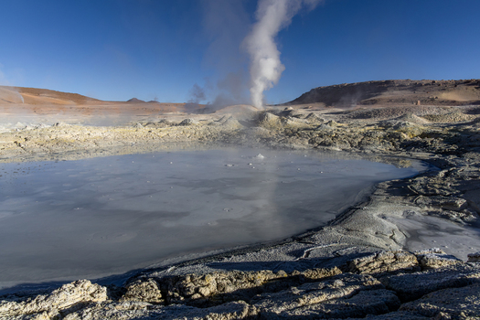 View of Geysers Sol de la Manana with bubbling mud pools and steam vents in the volcanic landscape of Sur Lipez Potosi Department Bolivia. View of Geysers Sol de la Manana with bubbling mud pools and steam vents in the volcanic landscape of Sur Lipez Potosi Department Bolivia.