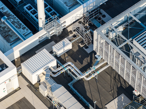 Aerial view of the Vantage Data Centers BER1 rooftop featuring industrial HVAC units cooling pipes and metal infrastructure in Ludwigsfelde Brandenburg Germany. Aerial view of the Vantage Data Centers BER1 rooftop featuring industrial HVAC units cooling pipes and metal infrastructure in Ludwigsfelde Brandenburg Germany.