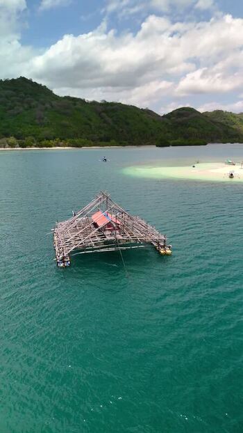 Aerial view of a fishing platform near Gili Bedis Indonesia. Aerial view of a fishing platform near Gili Bedis Indonesia.