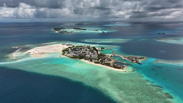 Aerial view of Gulhi island with turquoise waters and coral reefs Maldives. Aerial view of Gulhi island with turquoise waters and coral reefs Maldives.