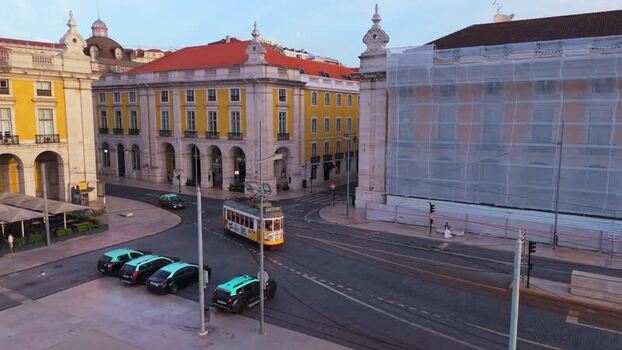 Aerial view of Praca do Comercio and a yellow tram Portugal.