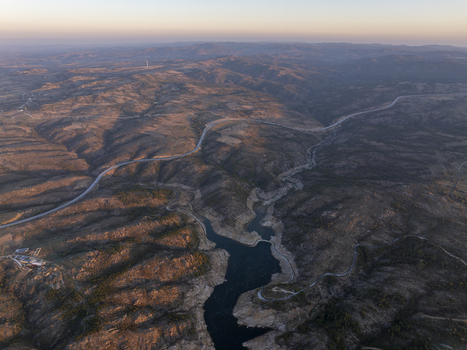 Aerial view of the winding reservoir and surrounding hilly landscape during golden hour in Kirklareli Merkez Kirklareli Turkey. Aerial view of the winding reservoir and surrounding hilly landscape during golden hour in Kirklareli Merkez Kirklareli Turkey.