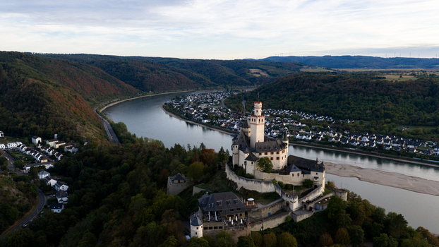 Aerial view of Marksburg castle perched on a hill overlooking the Rhine river and the town of Braubach Rhineland Palatinate Germany. Aerial view of Marksburg castle perched on a hill overlooking the Rhine river and the town of Braubach Rhineland Palatinate Germany.