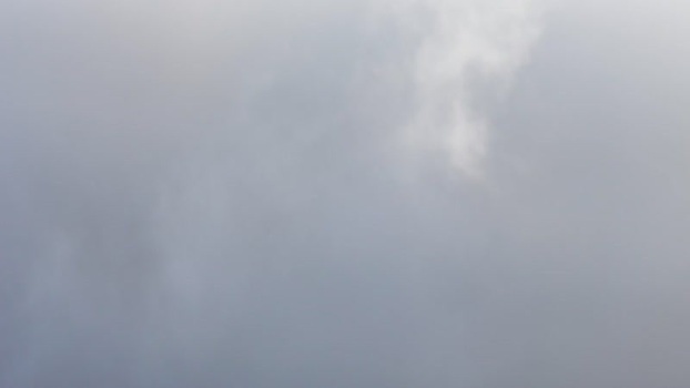 Aerial view of Windpark Freilanderalm 2 in the fog Austria.
