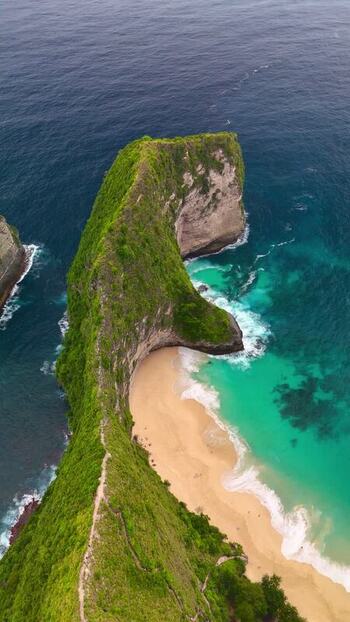 Aerial view of Kelingking Beach and turquoise ocean in Indonesia. Aerial view of Kelingking Beach and turquoise ocean in Indonesia.