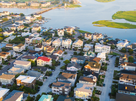 Aerial view of Wrightsville Beach showing coastal residential houses streets and a bridge over the water in Wrightsville Beach North Carolina United States.