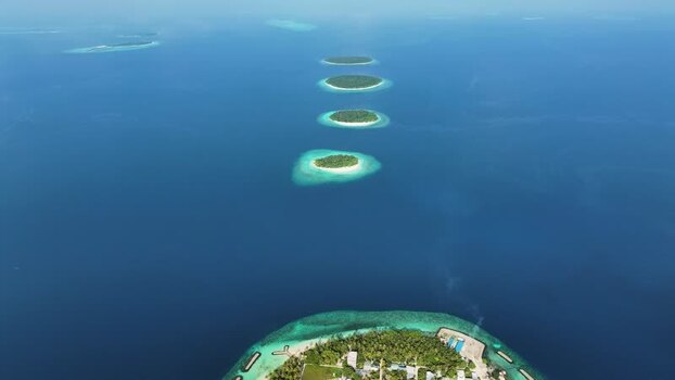 Aerial view of tropical islands in the ocean Maldives. Aerial view of tropical islands in the ocean Maldives.