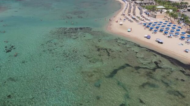Aerial view of beach with turquoise water in Northern Cyprus.