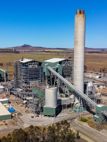 Aerial view of Millmerran Power Station with its tall chimney industrial structures and conveyor belts in a rural landscape in Domville Queensland Australia. Aerial view of Millmerran Power Station with its tall chimney industrial structures and conveyor belts in a rural landscape in Domville Queensland Australia.