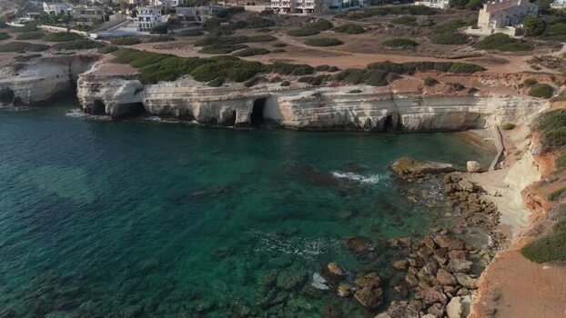 Aerial view of sea caves along the rocky coastline of Cyprus.