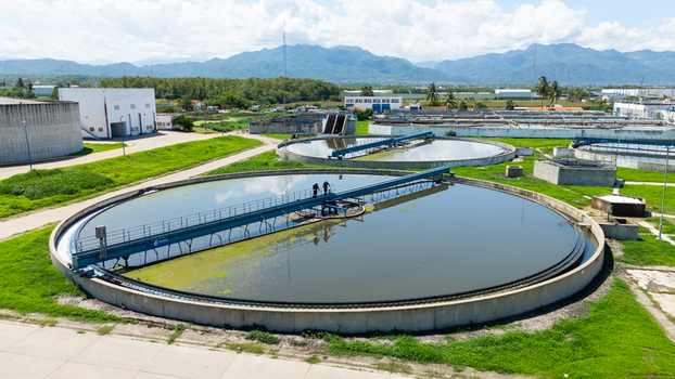 Aerial view of circular water treatment pools reflecting the sky overlooked by distant mountains Puerto Vallarta Mexico. Aerial view of circular water treatment pools reflecting the sky overlooked by distant mountains Puerto Vallarta Mexico.