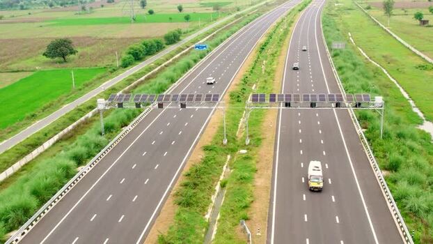 Aerial view of highway with solar panels in India. Aerial view of highway with solar panels in India.