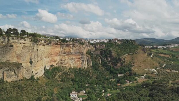 Aerial view of the historic cliffs and white town of Ronda Spain.