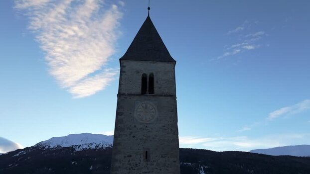 Aerial view of the historic bell tower in Graun im Vinschgau Italy. Aerial view of the historic bell tower in Graun im Vinschgau Italy.