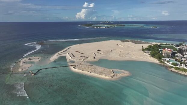 Aerial view of Gulhi island with turquoise waters and sandy shores Maldives. Aerial view of Gulhi island with turquoise waters and sandy shores Maldives.
