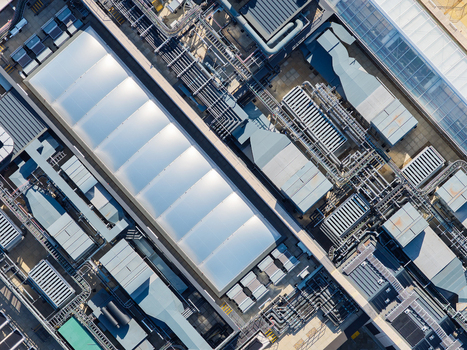 Aerial view of the Data Center at Oxford University featuring complex industrial rooftop ventilation systems cooling units and metallic piping in Oxford England United Kingdom. Aerial view of the Data Center at Oxford University featuring complex industrial rooftop ventilation systems cooling units and metallic piping in Oxford England United Kingdom.