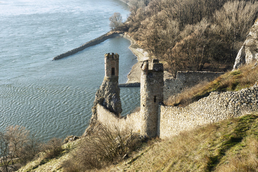 View of Devin Castle ruins with stone towers and walls on a rocky cliff overlooking the Danube river in Bratislava IV Bratislava Region Slovakia. View of Devin Castle ruins with stone towers and walls on a rocky cliff overlooking the Danube river in Bratislava IV Bratislava Region Slovakia.