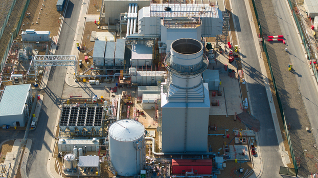 Aerial view of Millbrook Power Plant featuring industrial infrastructure cooling units and storage tanks in Stewartby England United Kingdom. Aerial view of Millbrook Power Plant featuring industrial infrastructure cooling units and storage tanks in Stewartby England United Kingdom.