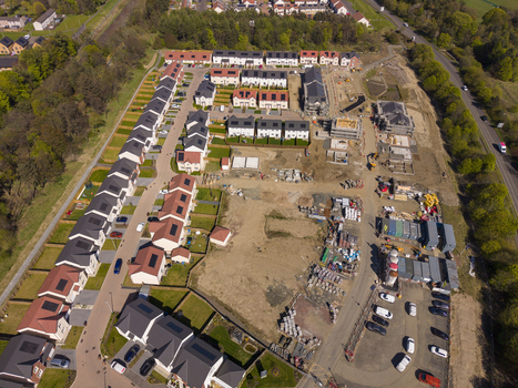 Linlithgow United Kingdom 29 April 2026 Aerial view of a new housing development under construction with modern homes featuring solar panels and building materials. Linlithgow United Kingdom 29 April 2026 Aerial view of a new housing development under construction with modern homes featuring solar panels and building materials.