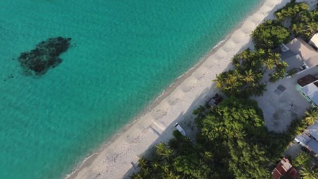 Aerial view of a tropical beach and turquoise water Maldives. Aerial view of a tropical beach and turquoise water Maldives.