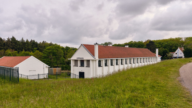 Wieringerwerf Netherlands 17 May 2026 View of Gemaal Leemans pumping station with its white facade and red tiled roof under a cloudy sky.