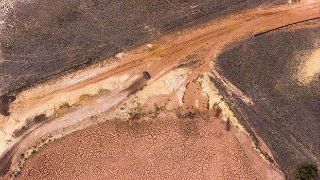 Aerial view of industrial salt patterns and textured terrain with brown and yellow sand deposits near Useless Loop in Kalbarri Western Australia Australia. Aerial view of industrial salt patterns and textured terrain with brown and yellow sand deposits near Useless Loop in Kalbarri Western Australia Australia.