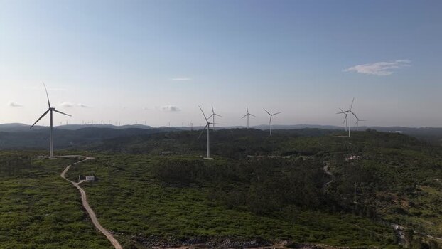 Aerial view of wind turbines on green hills Portugal. Aerial view of wind turbines on green hills Portugal.