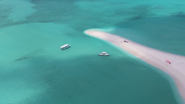 Aerial view of a white sandbank and boats in turquoise water Maldives. Aerial view of a white sandbank and boats in turquoise water Maldives.