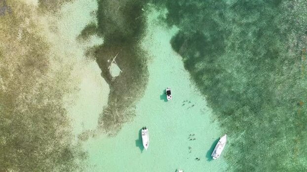 Aerial view of boats in the waters of Grand Cayman Cayman Islands. Aerial view of boats in the waters of Grand Cayman Cayman Islands.