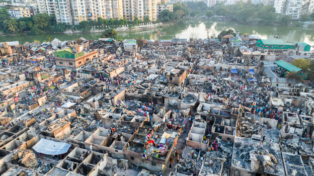 Aerial view of a densely packed urban settlement a chaotic mix of structures and debris showcasing the city s vibrant yet challenging urban landscape Dhaka Dhaka Division Bangladesh. Aerial view of a densely packed urban settlement a chaotic mix of structures and debris showcasing the city s vibrant yet challenging urban landscape Dhaka Dhaka Division Bangladesh.