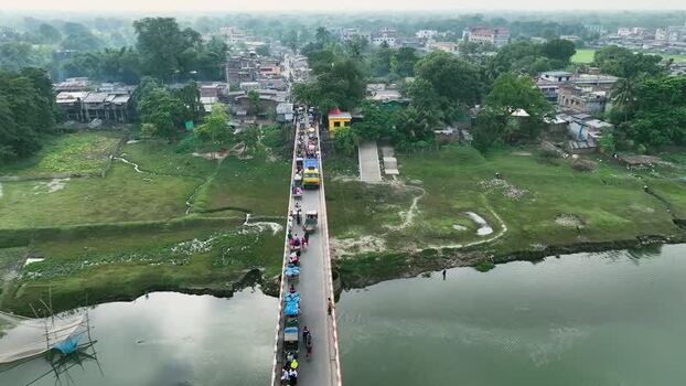 Aerial view of a busy bridge over a river Bangladesh.