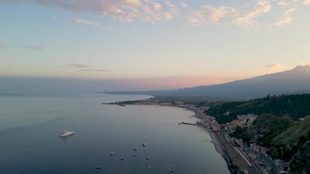 Aerial view of the coastline and Mount Etna in Taormina Italy. Aerial view of the coastline and Mount Etna in Taormina Italy.
