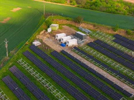 Aerial view of FVE Bohumilice solar power plant with rows of photovoltaic panels and storage containers surrounded by fields Klobouky u Brna Jihomoravsky kraj Czechia. Aerial view of FVE Bohumilice solar power plant with rows of photovoltaic panels and storage containers surrounded by fields Klobouky u Brna Jihomoravsky kraj Czechia.