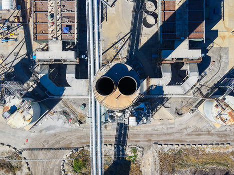 Aerial view of Millmerran Power Station showing industrial cooling towers pipelines and infrastructure in Domville Queensland Australia. Aerial view of Millmerran Power Station showing industrial cooling towers pipelines and infrastructure in Domville Queensland Australia.