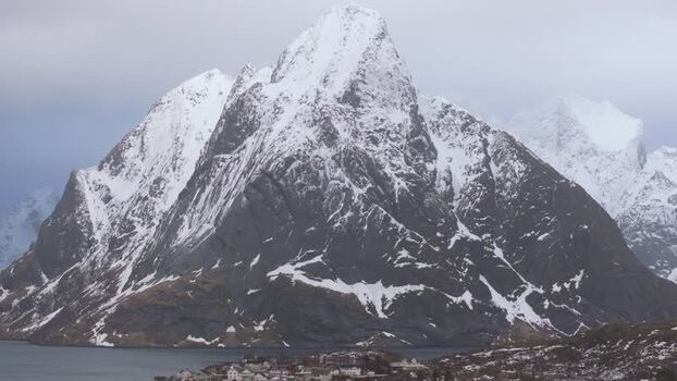 Aerial view of snowy Lofoten mountains in winter Norway.